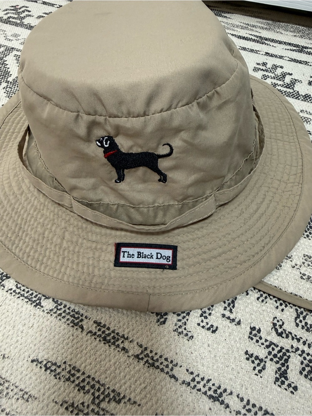 The Black Dog Tan Bucket Hat with Black Dog Embroidery